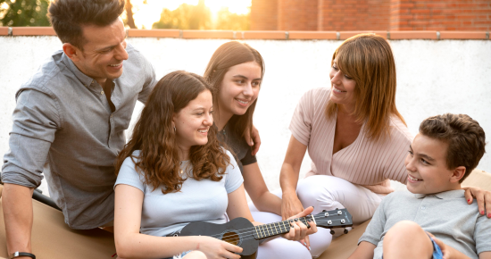 family-gathering-playing-ukulele-together